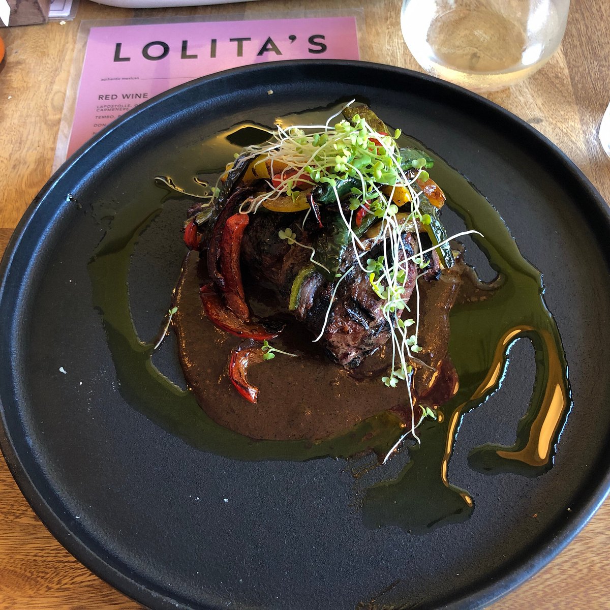 Lolita's signature dishes Ribeye AguachileDuck ConfitCarne Asada